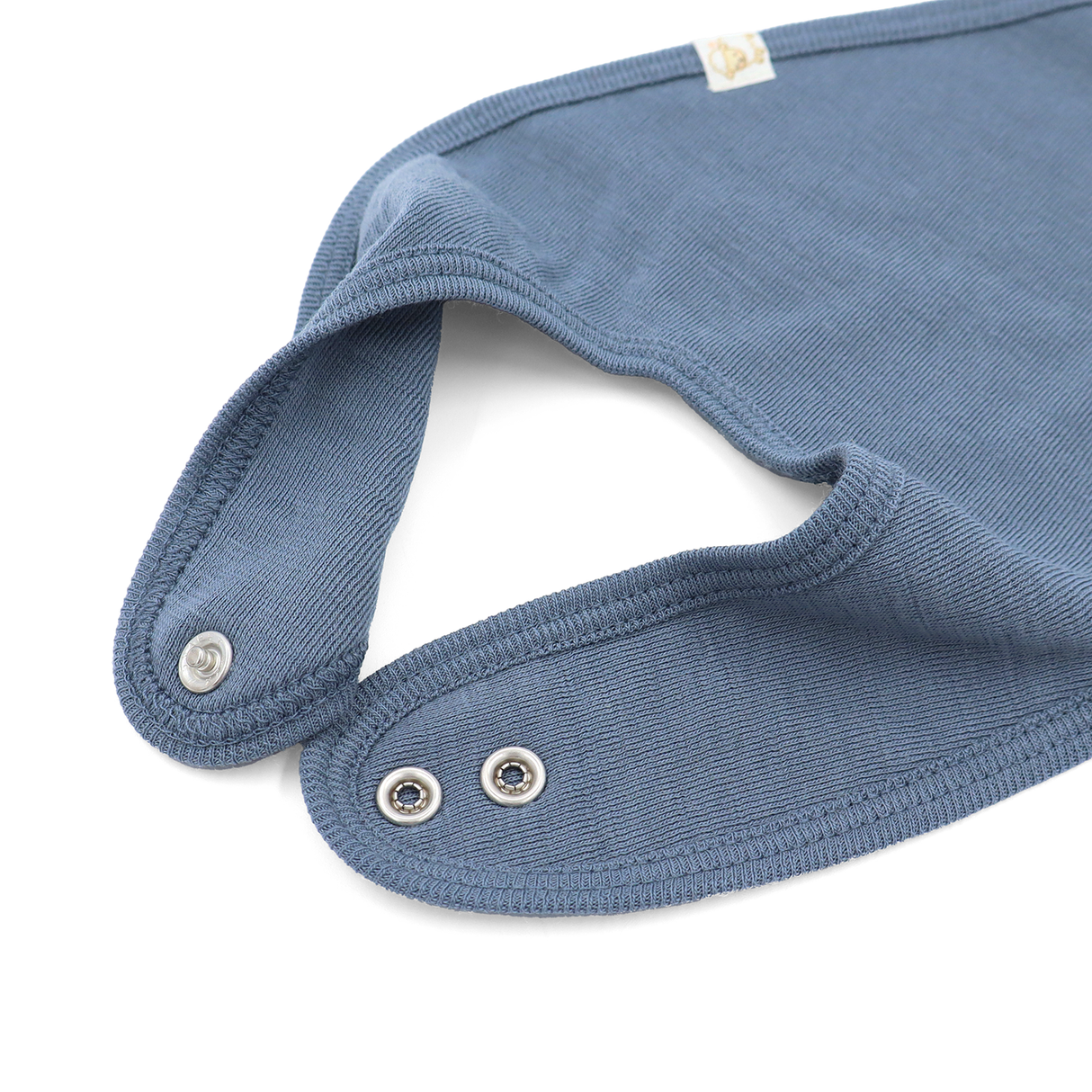 Bib from 100% certified fine merino with a pacifier clip function