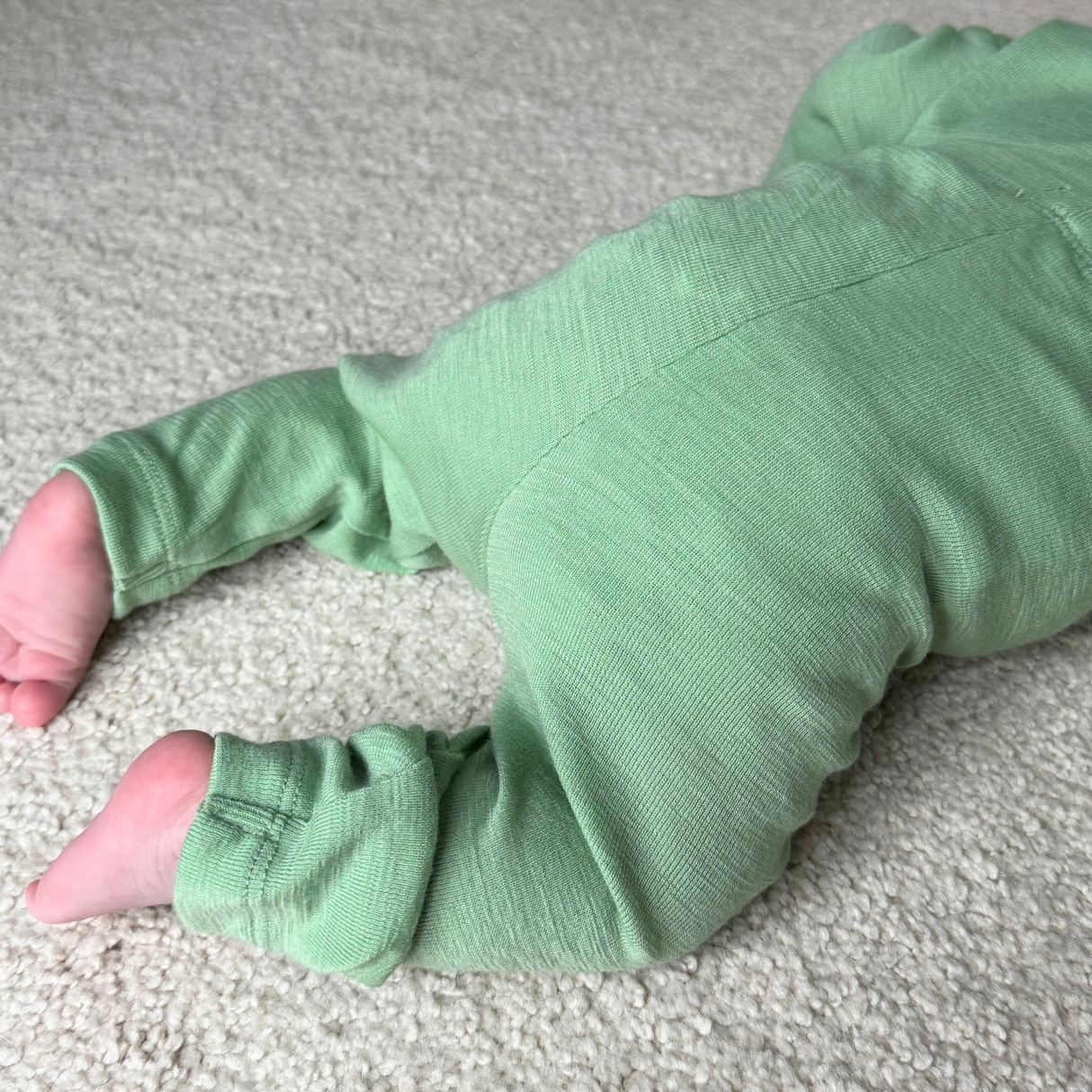 Long-sleeved bodysuit with round neckline made of 100% organic merino wool